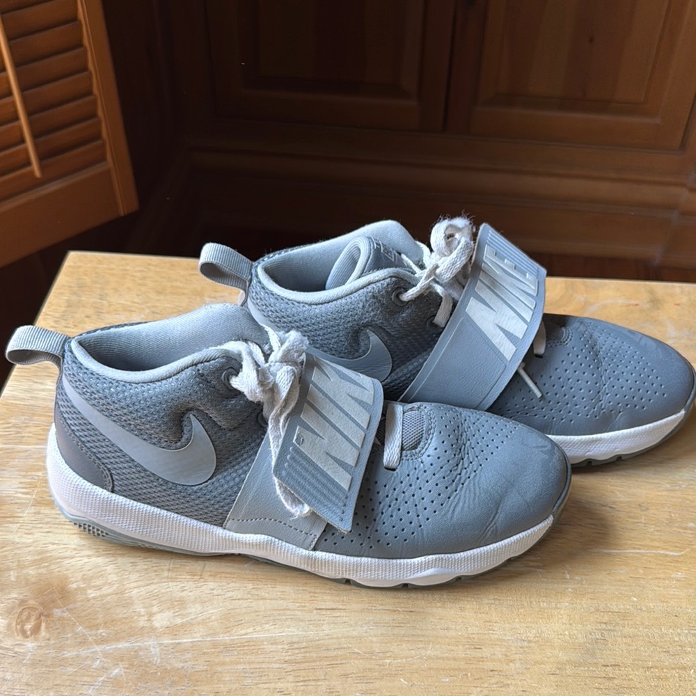 Size 6.5. Nike Gray Sneakers with Secure Fit and Modern Design